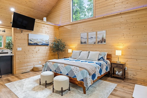 King-size Bed with Wall-Mounted Television