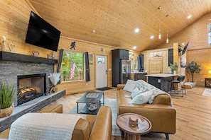 Wall Mounted Television and Gas Log Fireplace