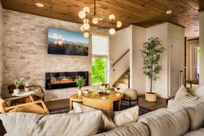A cozy living room with an indoor fireplace