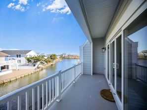 Step out onto the balcony to experience gorgeous canal views, perfect for those seeking a peaceful retreat close to the beach.