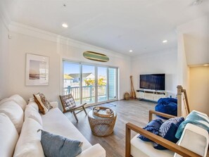 This elegantly designed living space offers a cozy retreat with comfortable seating and ample natural light, perfect for taking in the tranquil surroundings.