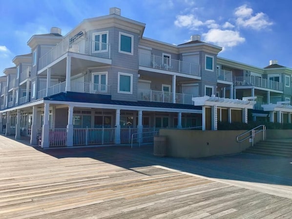 This charming beach-area condo features three bedrooms and three baths, with a spacious layout and inviting porches perfect for enjoying coastal views.