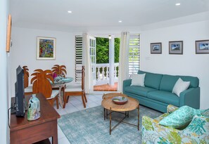 Comfy living room area with sleeper couch and airconditioning.