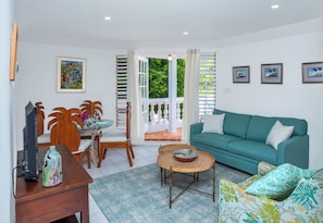 Comfy living room area with sleeper couch and airconditioning.
