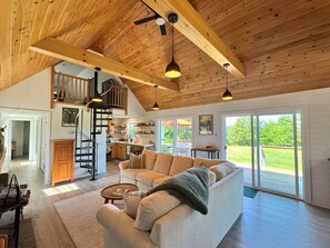 Living room with open concept to ktichen and dining room