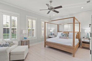 Primary Bedroom with a King bed, TV, closet, and ensuite bathroom access.
