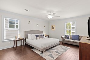 A restful retreat with ample windows and a cozy bed.