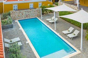 The spacious 10-by-4-meter saltwater pool is the heart of Villa Grandi. Surrounded by a tropical garden and comfortable Fermob loungers, it’s the perfect place to relax