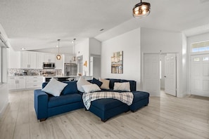 Whether it's chatting, playing games, or relaxing after a long day, this living space is the heart of the home.