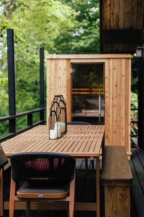 XL outdoor table seats 12, while the sauna is perfect for 2 at a time main