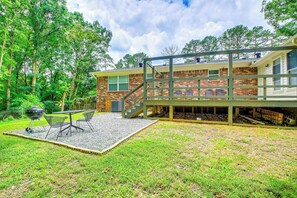 Partially Fenced Backyard | Dining Area | Charcoal Grill