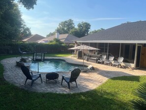 Back yard fire pit, pool & chairs