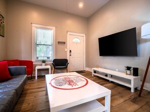 Living Room: Smart TV, Couch for 3, and 2 comfy chairs