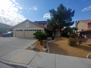 View of front yard. Mature tree provides shade and privacy.
