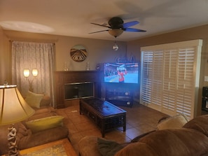 Living room leads out to back yard and pool.
