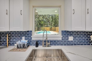 The kitchen overlooks the pool!