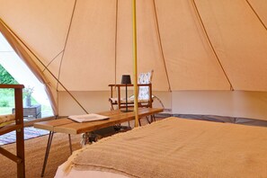 Each tent includes a double bed and two chairs, with two additional airbeds available on request.