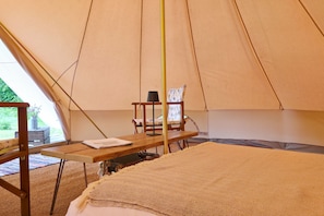 Each tent includes a double bed and two chairs, with two additional airbeds available on request.