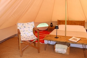 Each tent includes a double bed and two chairs, with two additional airbeds available on request.