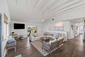 Living room with leather sectional with ocean views