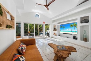 Amazing living room with a comfortable sofa, where you can watch TV, play Xbox or just relax, drenched in natural light.