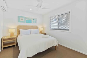 Whether it’s a nap after a swim or a full night’s rest, this queen bedroom is just the place.