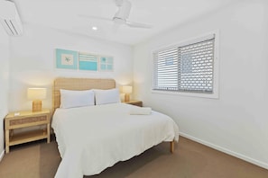 Whether it’s a nap after a swim or a full night’s rest, this queen bedroom is just the place.