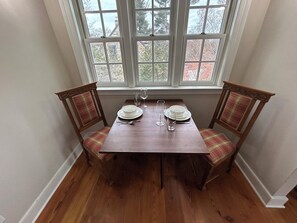 Drop Leaf table, flap raised for more seating.  Additional chairs in apt.