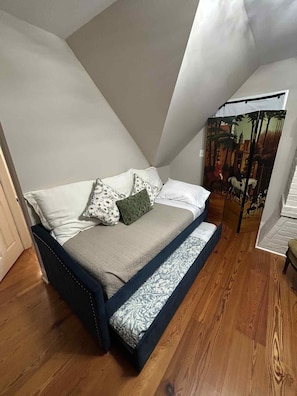 Trundle Bed, contains 2 twin beds that can be separated to sleep apart.