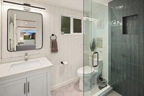 Elegant tile and vertical shiplap add charm and character