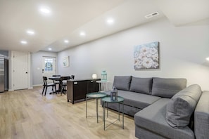 Stretch out and unwind in this open-concept living space, where the sofa invites movie nights and the dining nook is perfect for meals, games, or planning your next adventure..