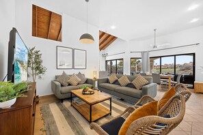 Bright, breezy, and beautifully styled—this living room is made for laid-back island vibes with plenty of space to relax and soak in the views.