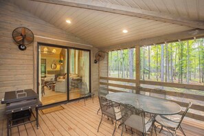 Inviting Screened in Porch with Blackstone Grill and Outdoor Seating