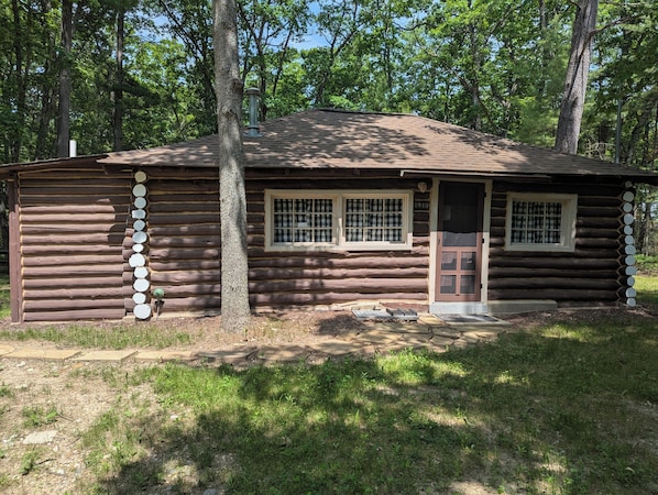 OVERALL: The front of the cabin in summer.