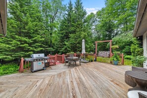 Spacious deck with grill and outdoor dining—perfect for cookouts and gatherings