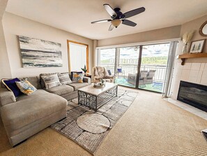 Relax in this modern living space with direct access to your private deck and panoramic Lake of the Ozarks views.