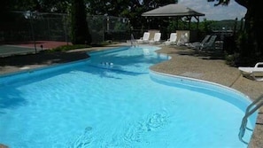 Cool off at the community pool, just steps from your lakefront condo — perfect for families and summer fun.