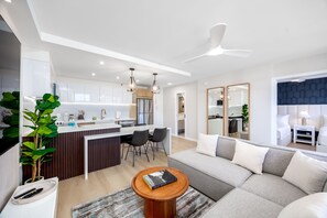 Welcome to this beautifully renovated space, where an open-concept living area and full kitchen invite you to relax and create delicious memories together!