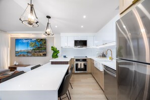 Prepare your favorite meals in your gourmet kitchen, complete with a full-sized refrigerator, oven, microwave, and dishwasher!