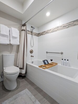 Ensuite bathroom w/ deep soaking tub, magnetic shower head, and heated floors