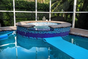 Unwind in the spa by the pool—lush, peaceful, and perfect after beach days
