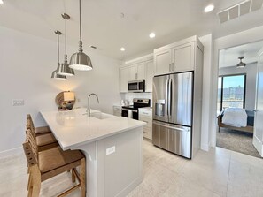 The fully appointed kitchen features top of the line appliances and makes cooking your favorite meals easy and convenient