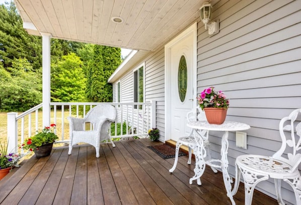 Enjoy the beautiful front porch surrounded by privacy!