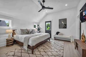 Sink into the plush king bed surrounded by calming neutrals and soft textures. Enjoy movie nights with smart TV streaming or step right outside through your private door to soak in fresh air and sunshine.