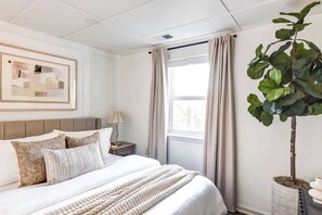 Unwind in comfort with a queen bed, premium memory foam mattress, stylish décor, 
blackout curtains for restful sleep, and thoughtful touches like ambient lighting and lush 
greenery. 