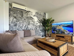 The villa is equipped with a large smart TV, offering a wide range of streaming options for your entertainment, ensuring a cozy and enjoyable experience during your stay.