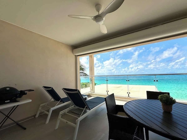 Savor your meals while enjoying the soothing sounds of the ocean from your private balcony, creating the perfect backdrop for a relaxing and memorable experience.