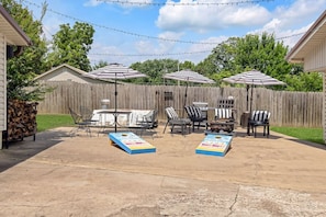 Patio area with seating and bbq grill