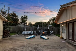 Patio area with seating and bbq grill