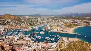 Enjoy panoramic views of the marina and bay from our condo.